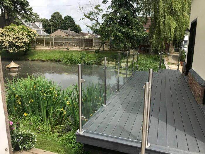 balustrade made from Glass next to pond