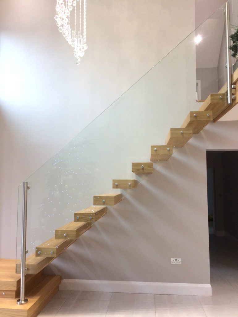 clean and tidy floating staircase with glass panel
