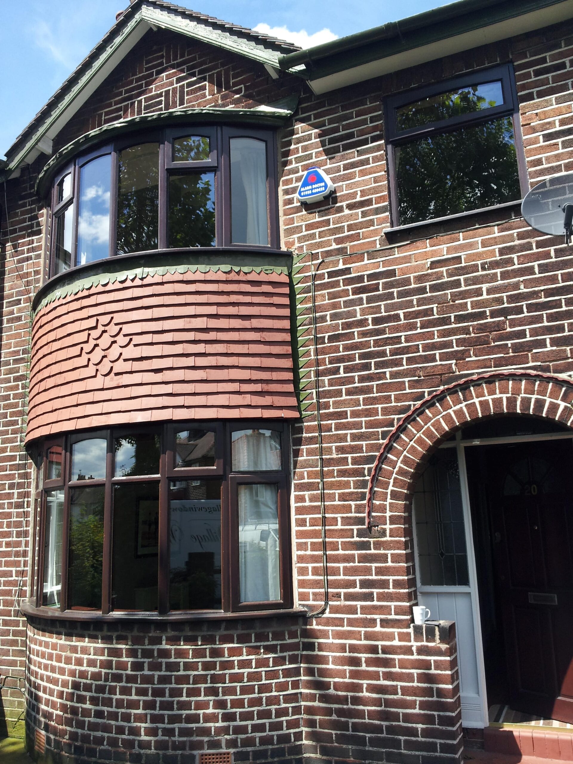 external photo front of double storey semi detached house with new windows