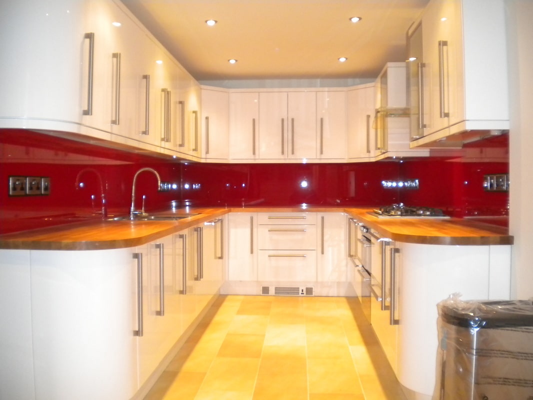 cream homely kitchen with red splashback