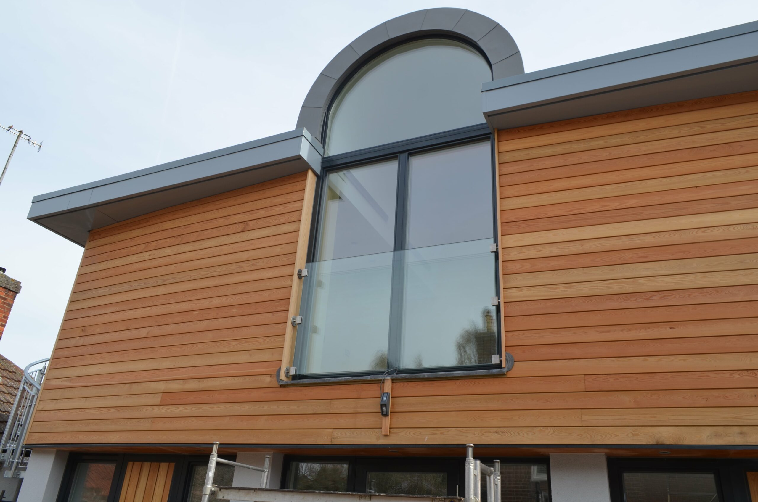 safety balcony installed outside upper storey arched glass doors