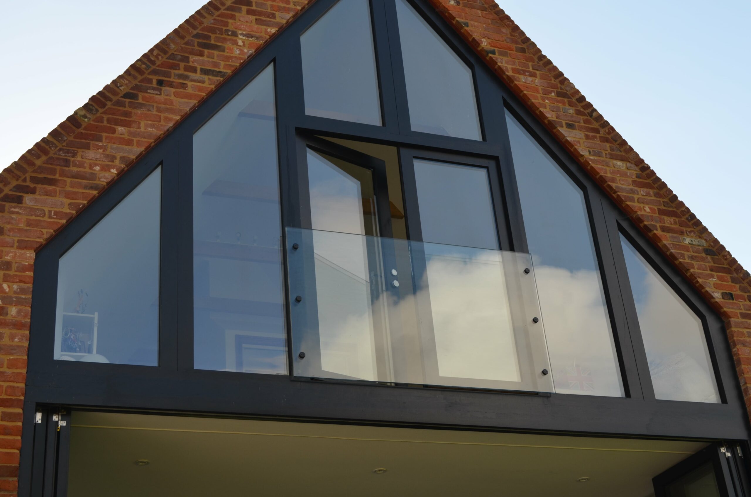 attic conversion floor to ceiling glass panel windows and doors with juliet balcony