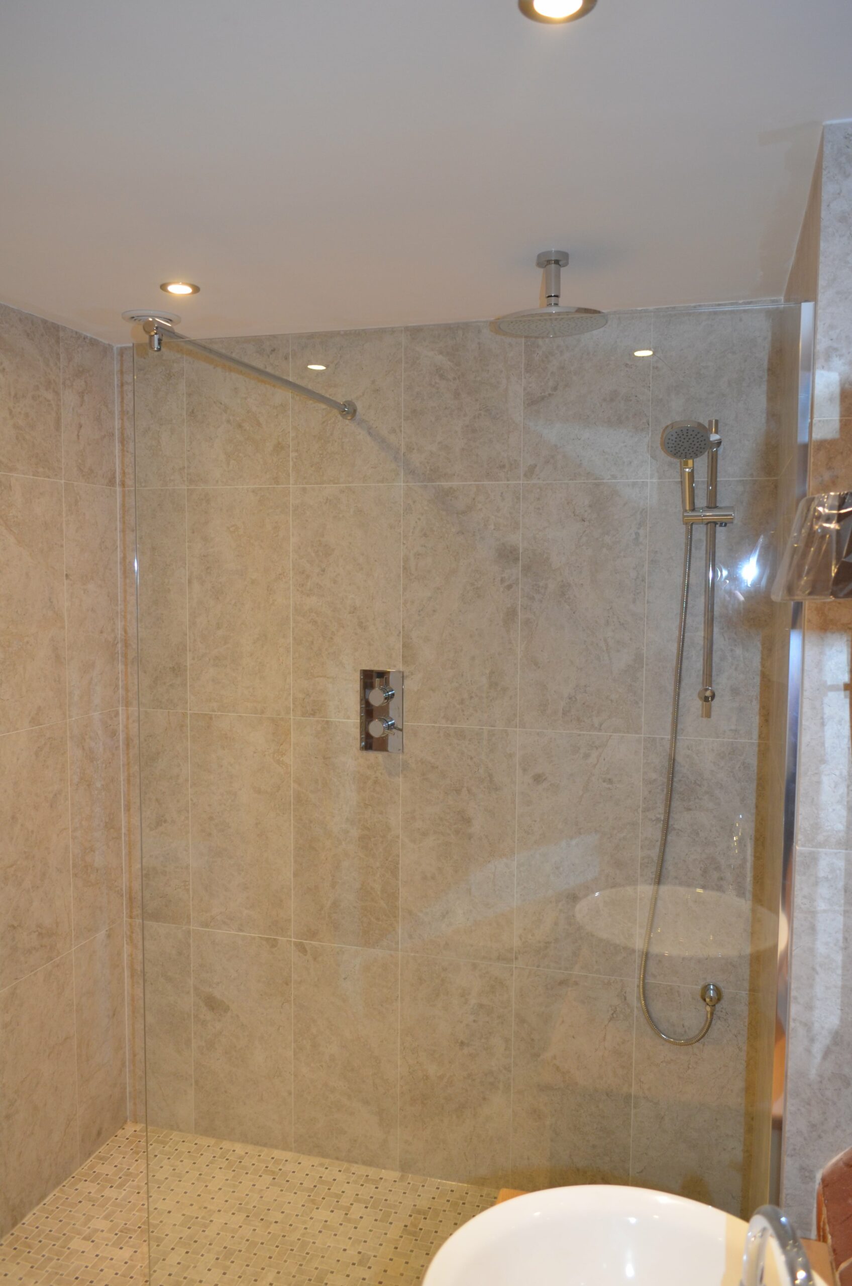 modern bathroom with large glass shower screen