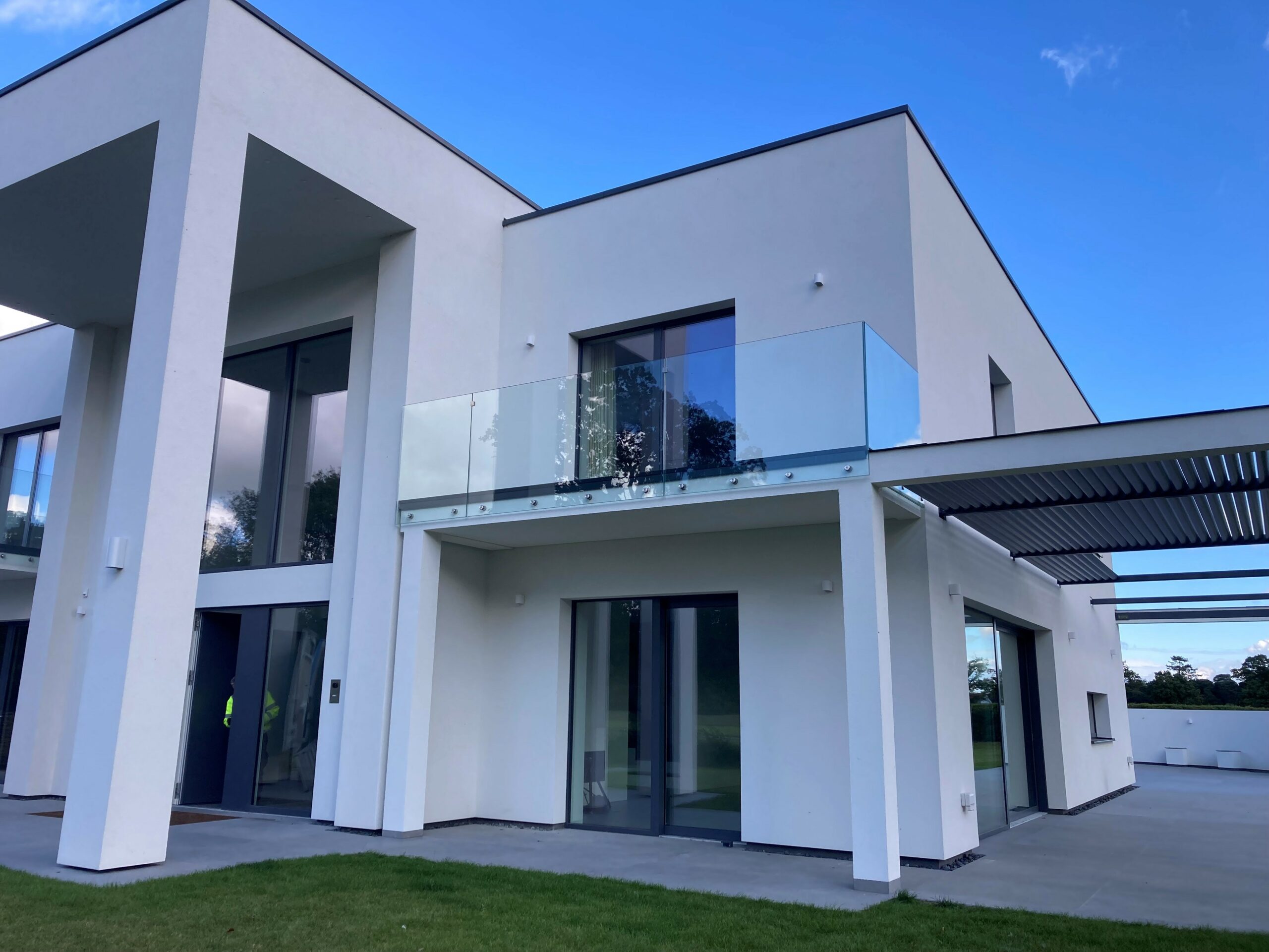 large mansion octagon house with wraparound balcony on second floor