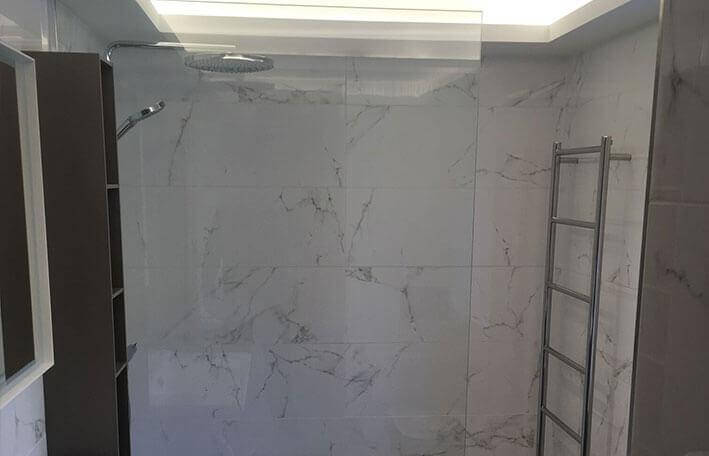 custom glass screen for marble walk in shower