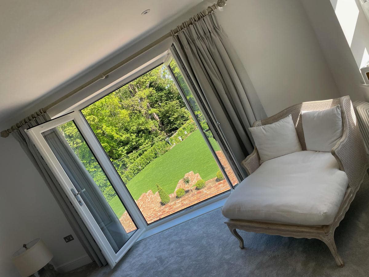 internal photo of living room with double opening doors out into garden