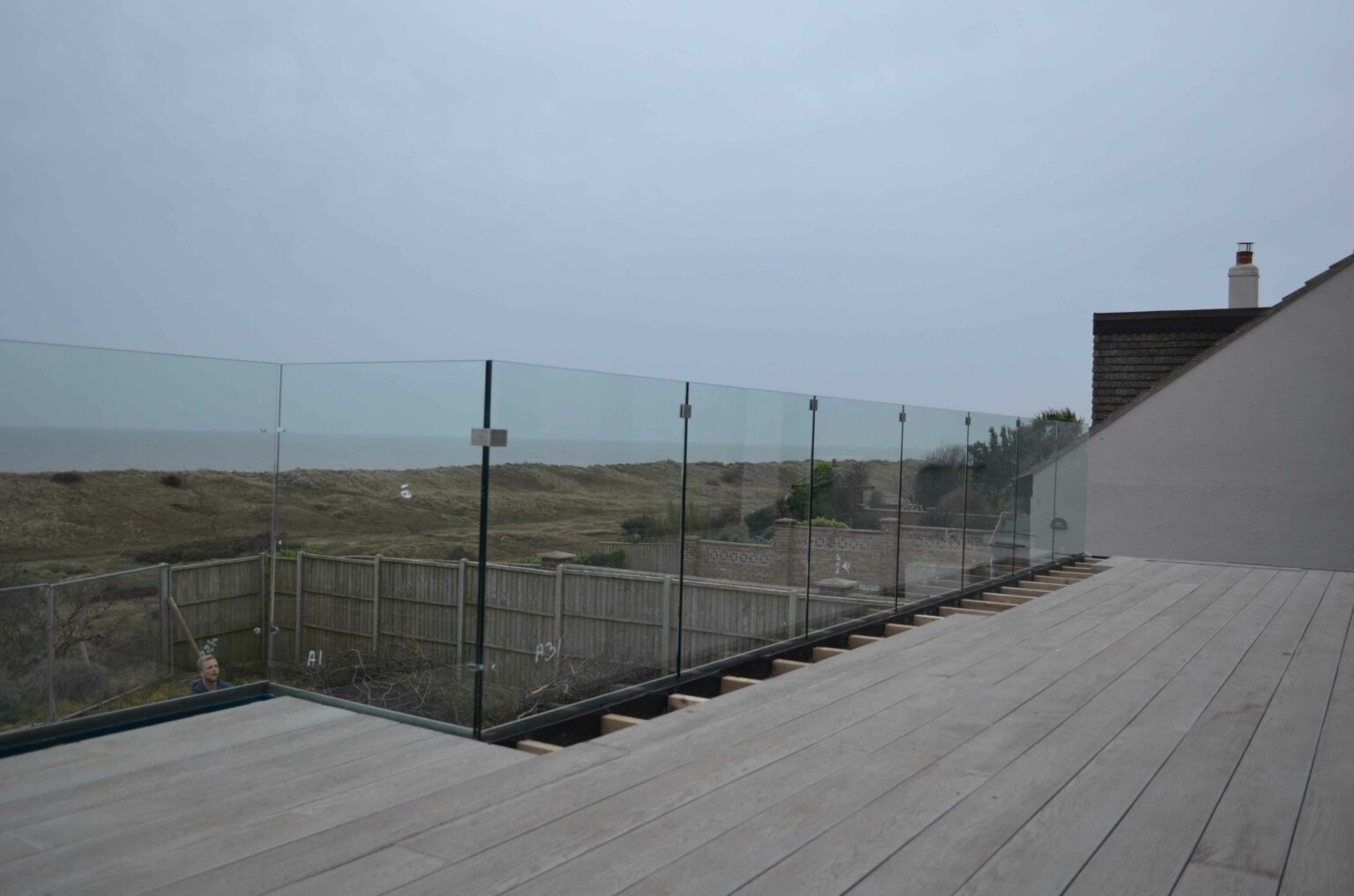 views from beach house overlooking gloomy cloudy day at the beach