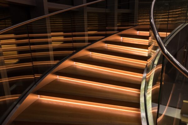 curved glass stair balustrade with led under step lighting