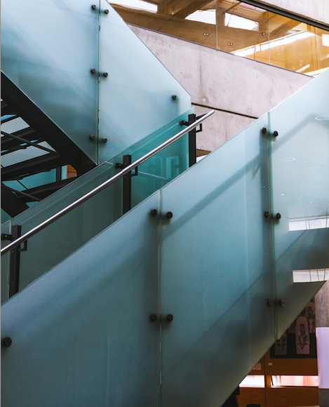 sandblasted wraparound staircase in commercial building