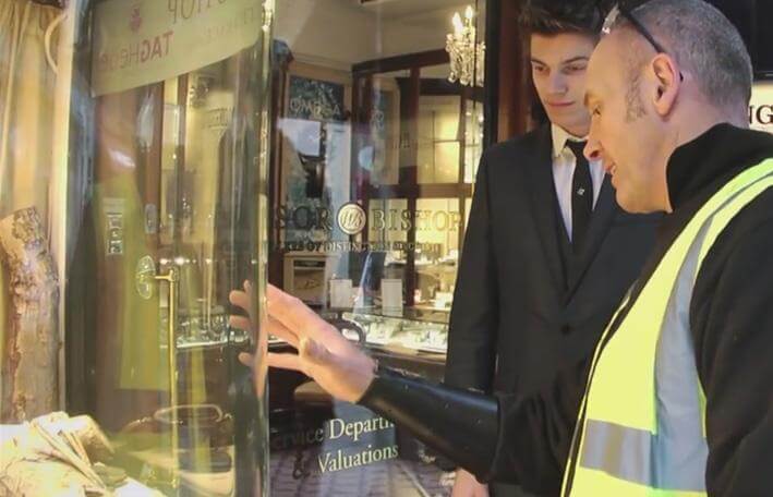 James talking to Winsor Bishop employee about glass shopfront