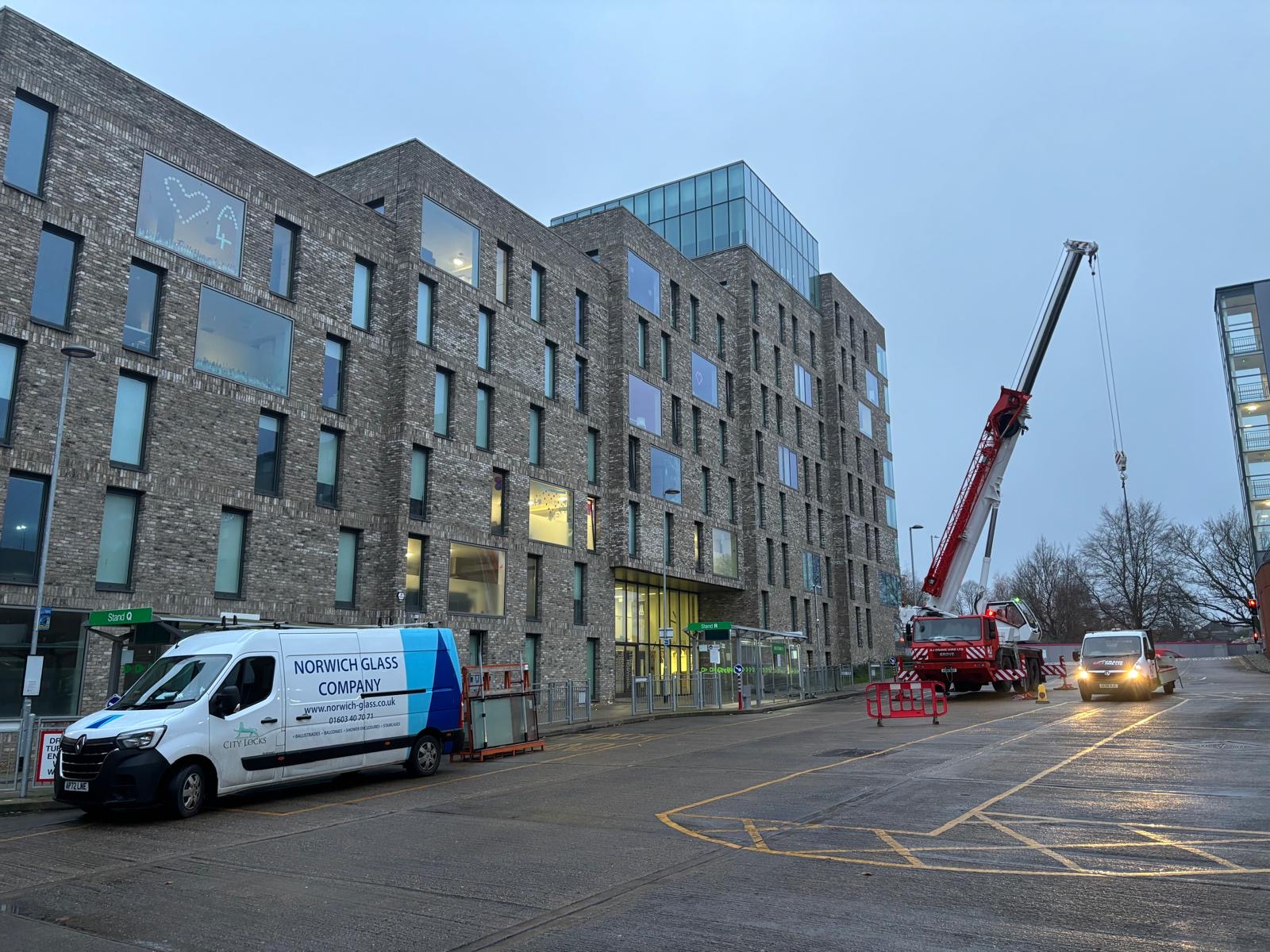 Student accommodation building with service trucks outside