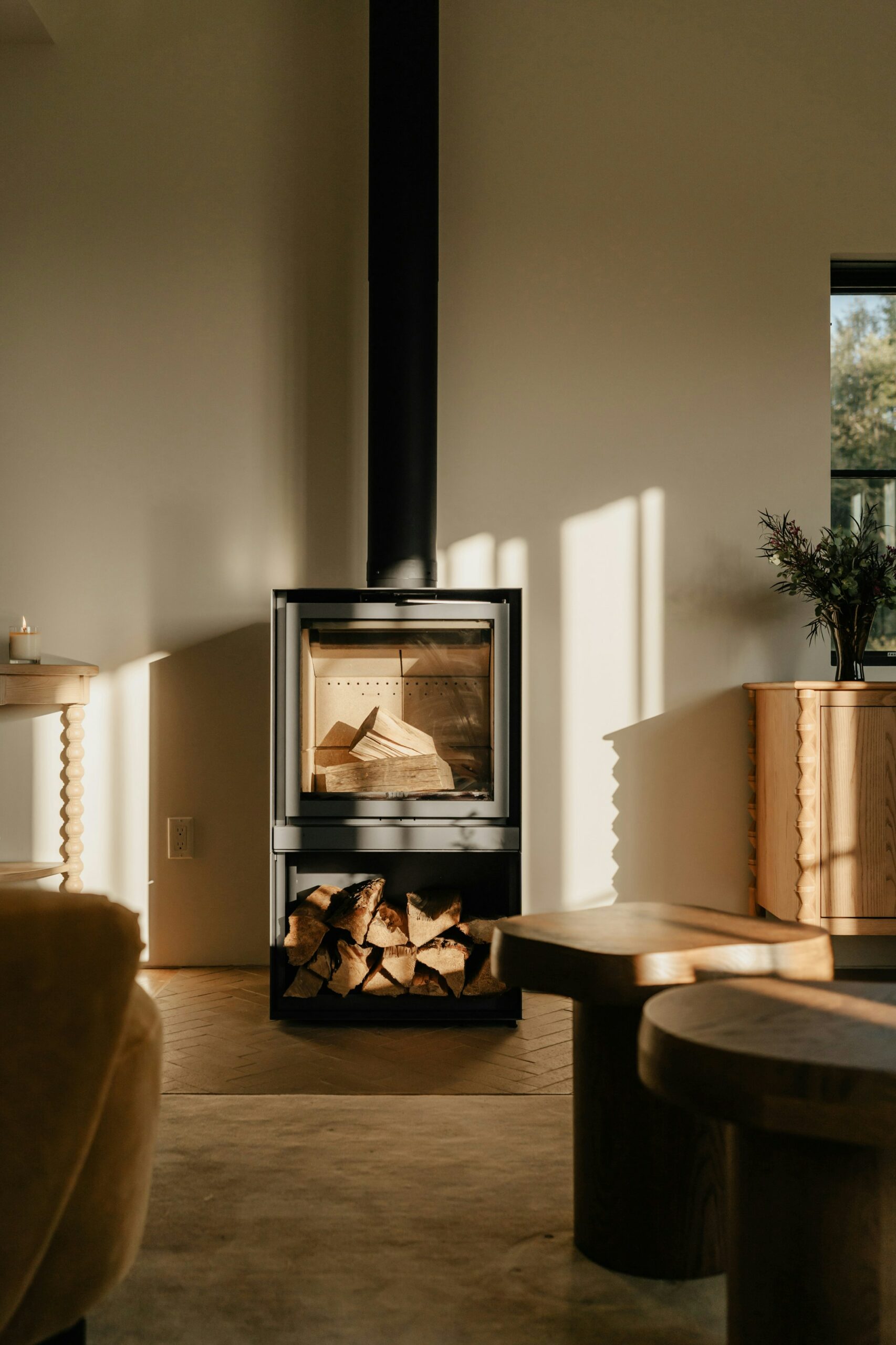 Unlit wood burner in beige living room